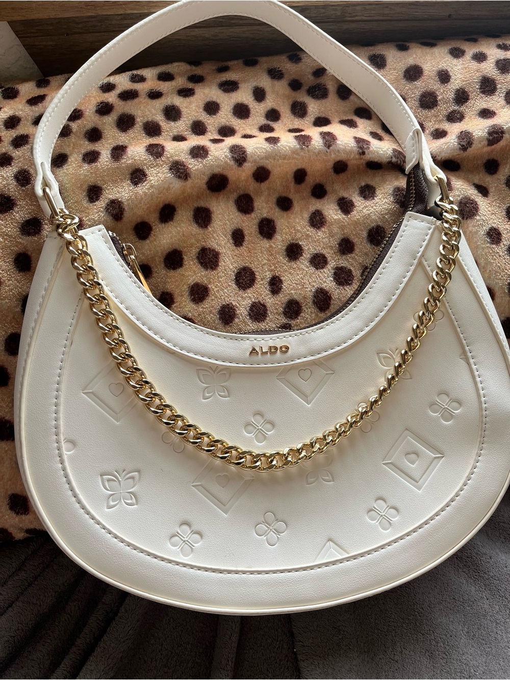 ALDO White Embossed Crescent Shoulder Bag with Gold Chain Accent